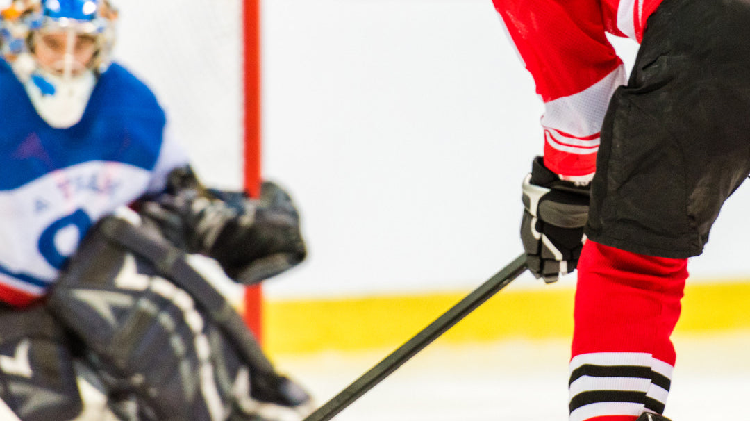 Hockey Players Playing Scoring A Goal
