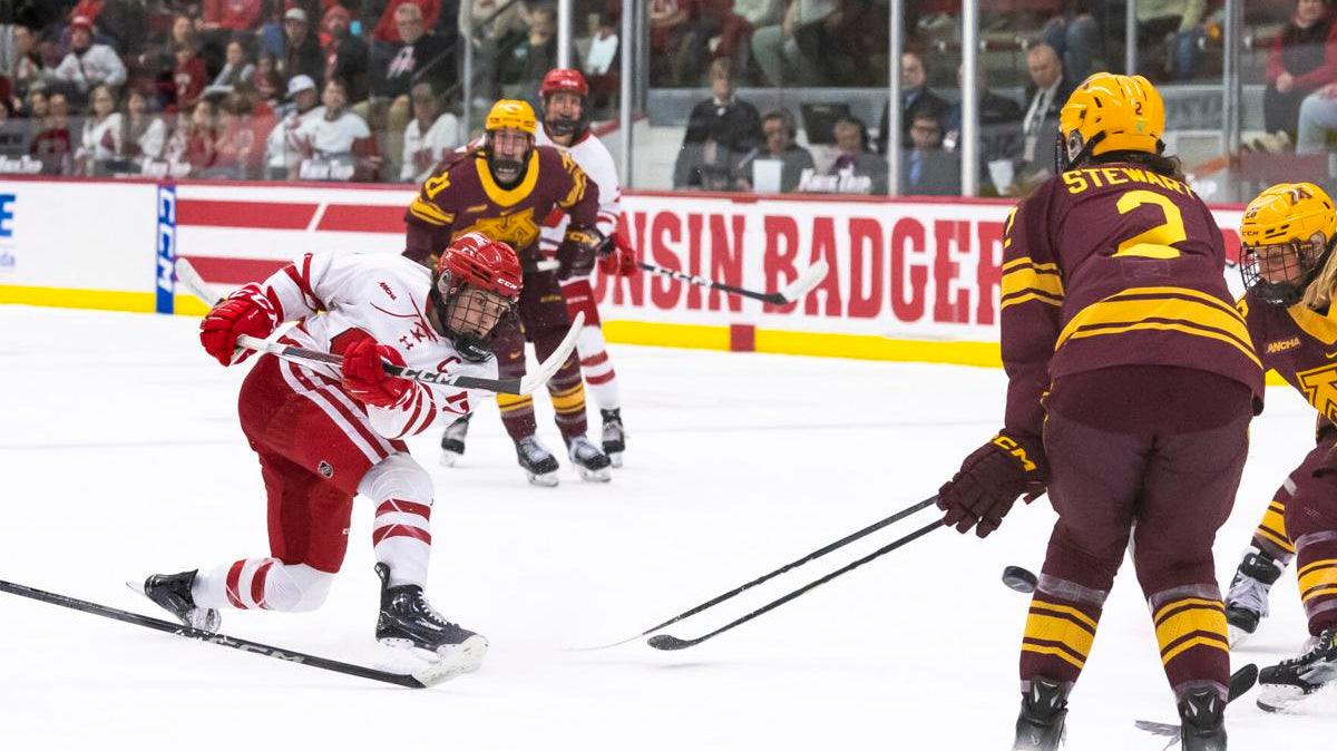 Hockey Players Playing An Intense Game