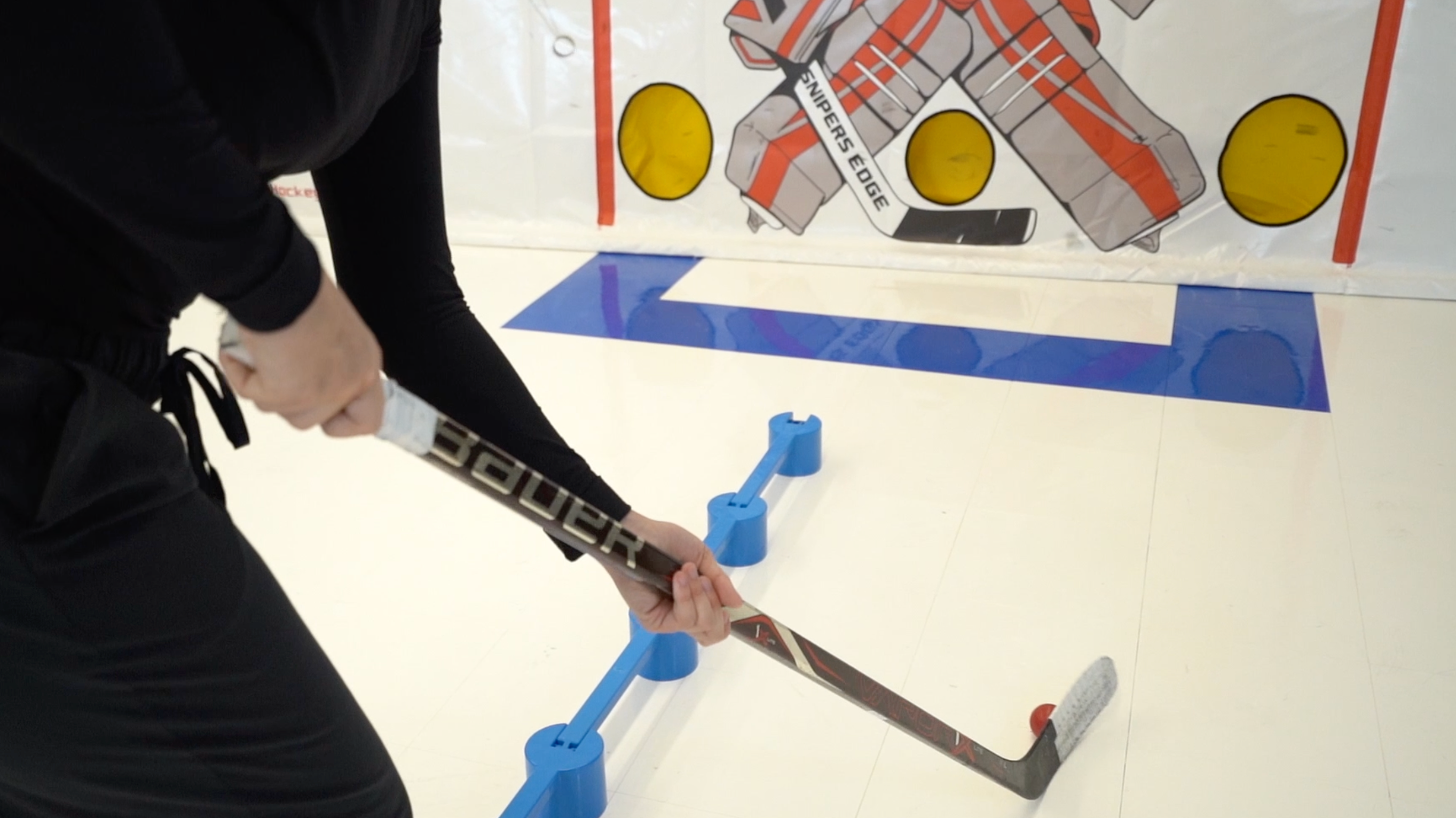 Person Doing Puck Handler Drills on Synthetic Ice