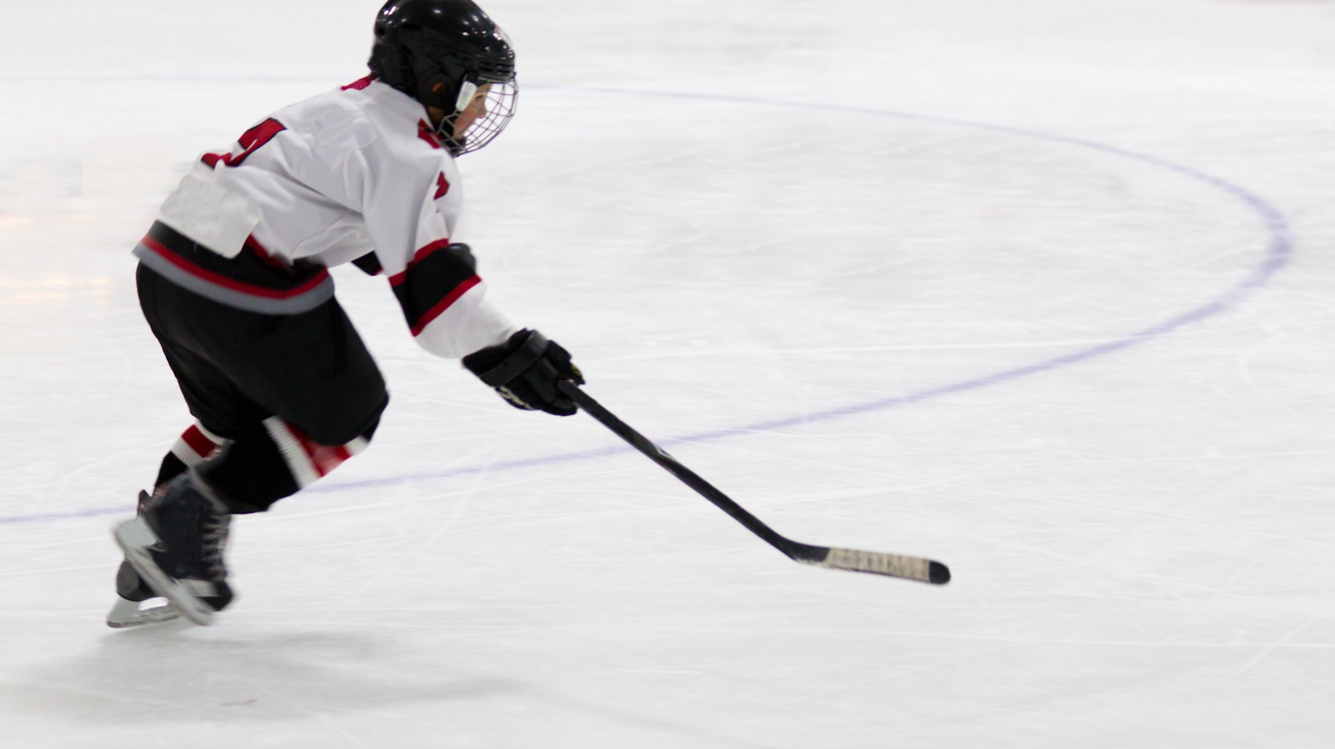 Youth player skating in open ice