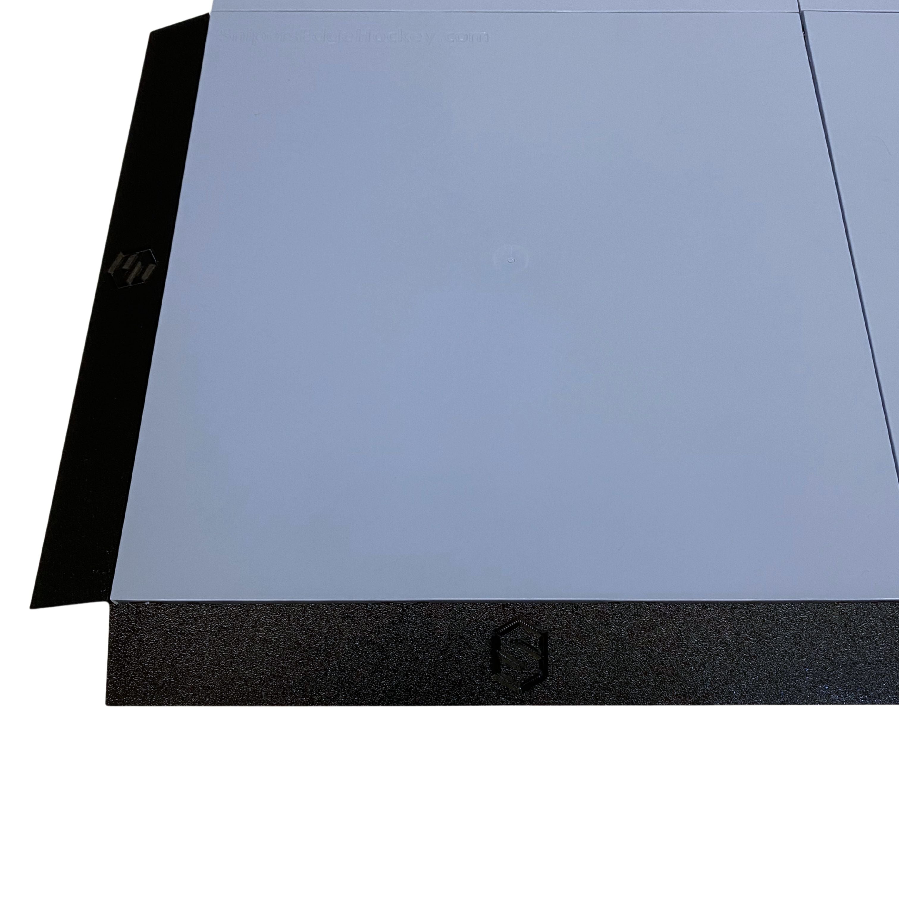 Snipers Edge edging connected to dryland hockey slick tiles