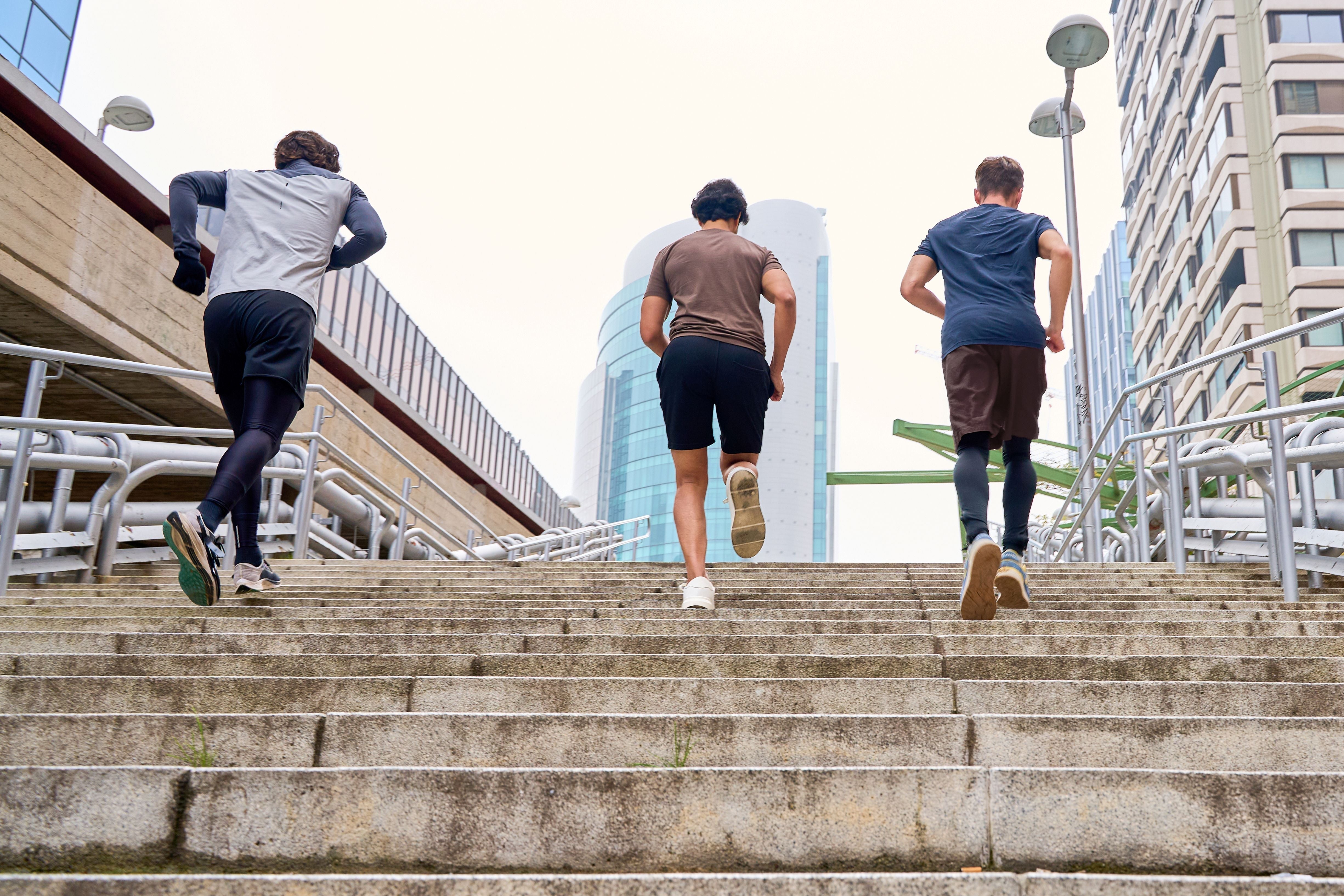 Athletes running up stairs