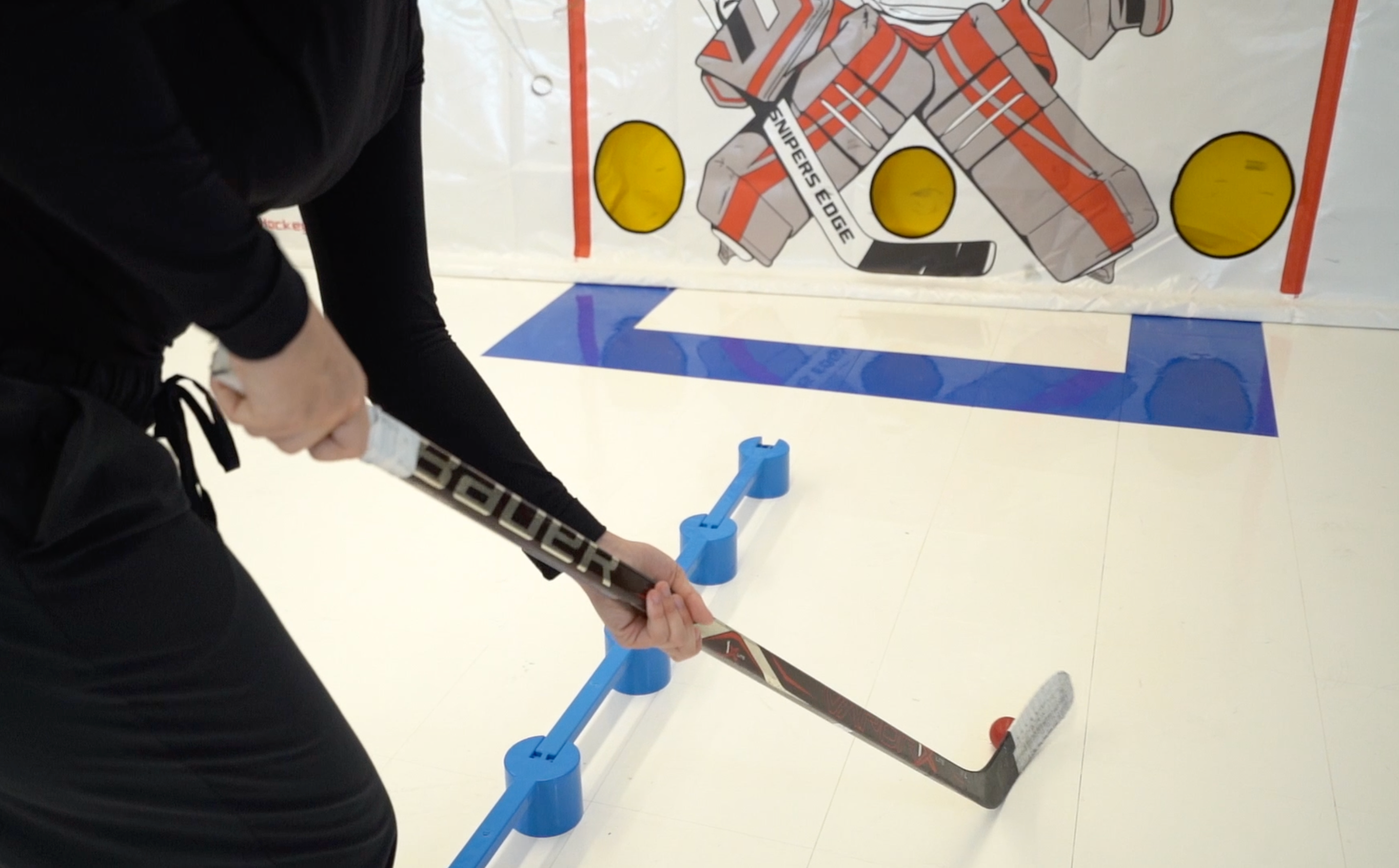 Person Doing Puck Handler Drills on Synthetic Ice
