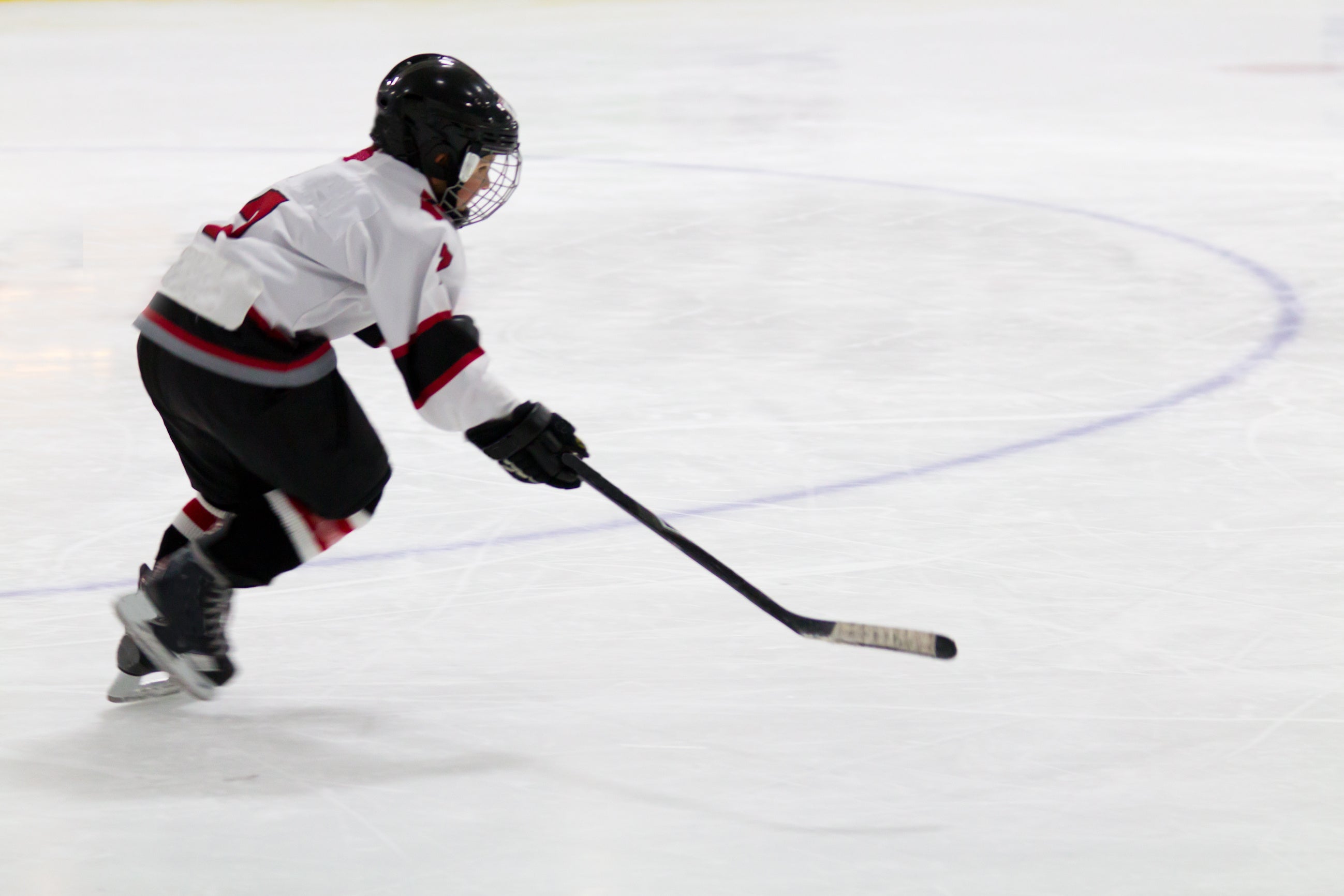Youth player skating in open ice