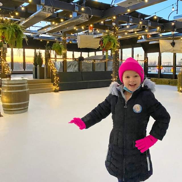 Girl skating on synthetic ice at Canadian Brewhouse in Edmonton, Alberta