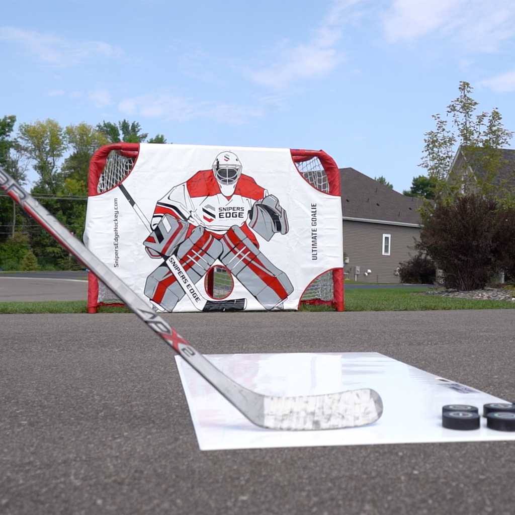 Player shooting into an Ultimate Goalie on their driveway