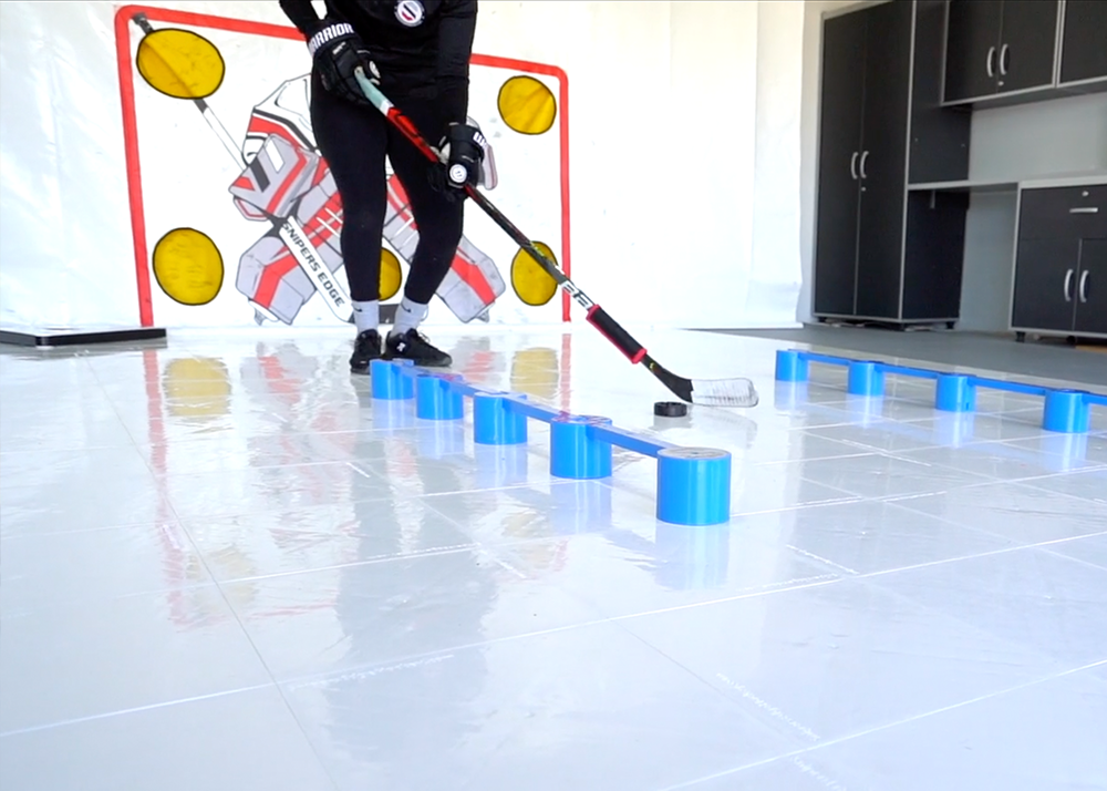 a player stickhandling through a SweetHands on white slick tiles