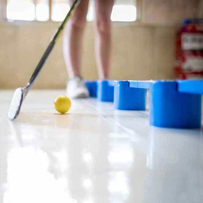 Close-up of player using yellow speed ball with SweetHands