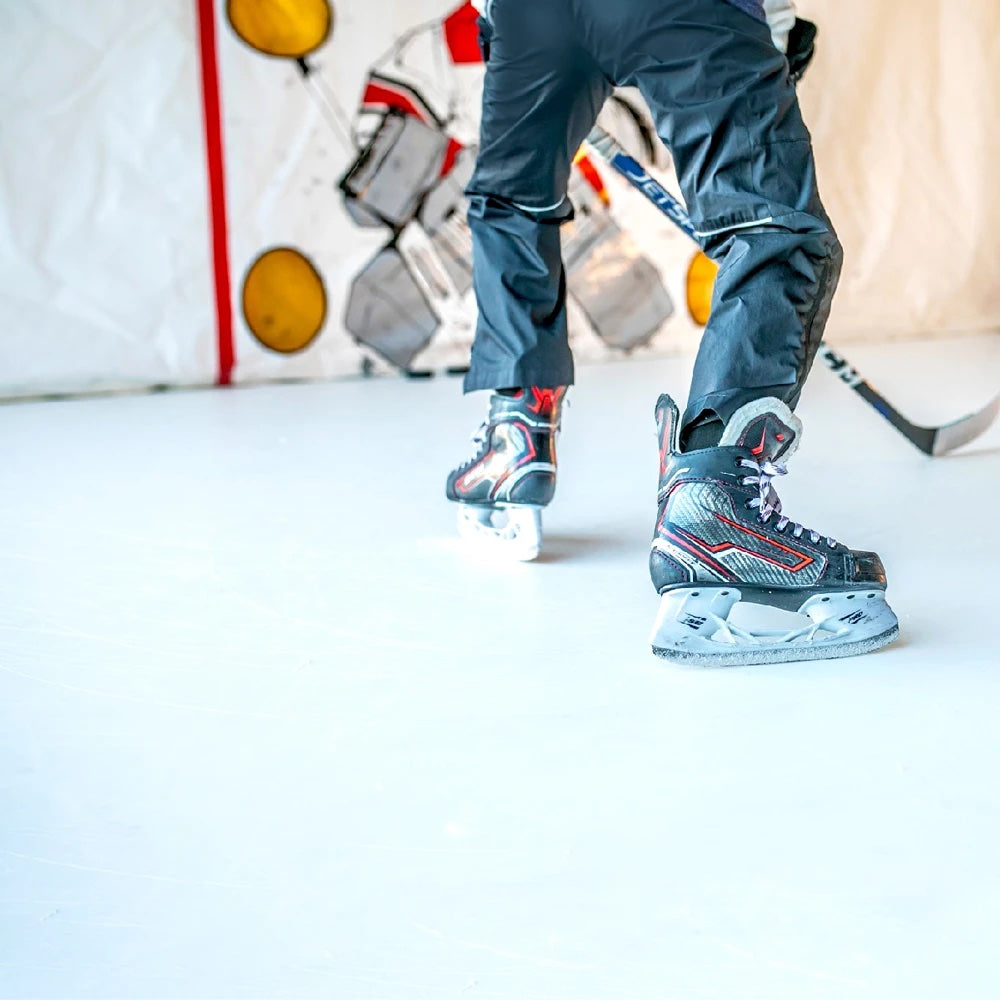 Close up of skates on synthetic ice